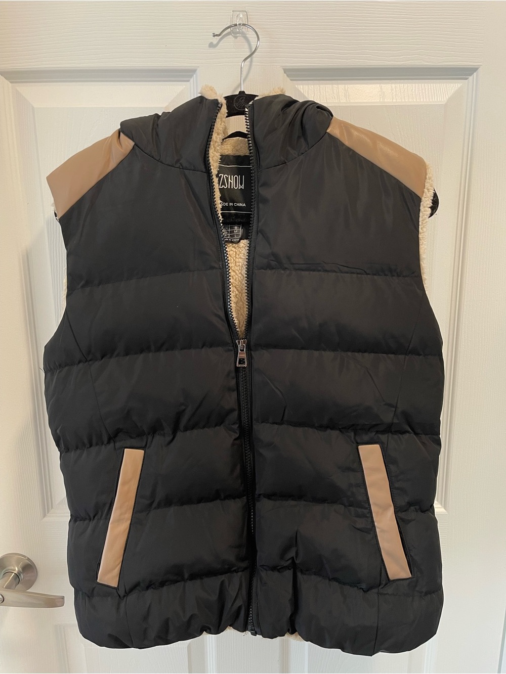 Black Sleeveless Puffer Vest with Tan Accents
